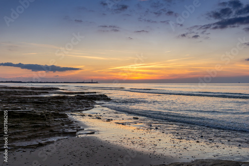 Wallpaper Mural sunset on the Atlantic coast of France on the Ile de with the Baleines Lighthouse behind Torontodigital.ca