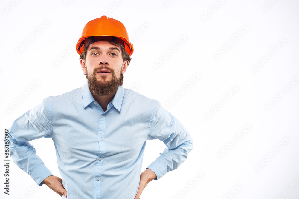 Man in working uniform orange hard hat lifestyle official