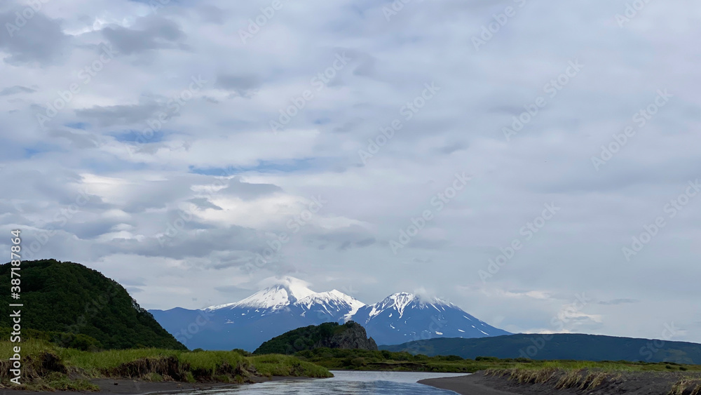 Volcanoes, hills, mountains and rivers. Amazing nature of Kamchatka.