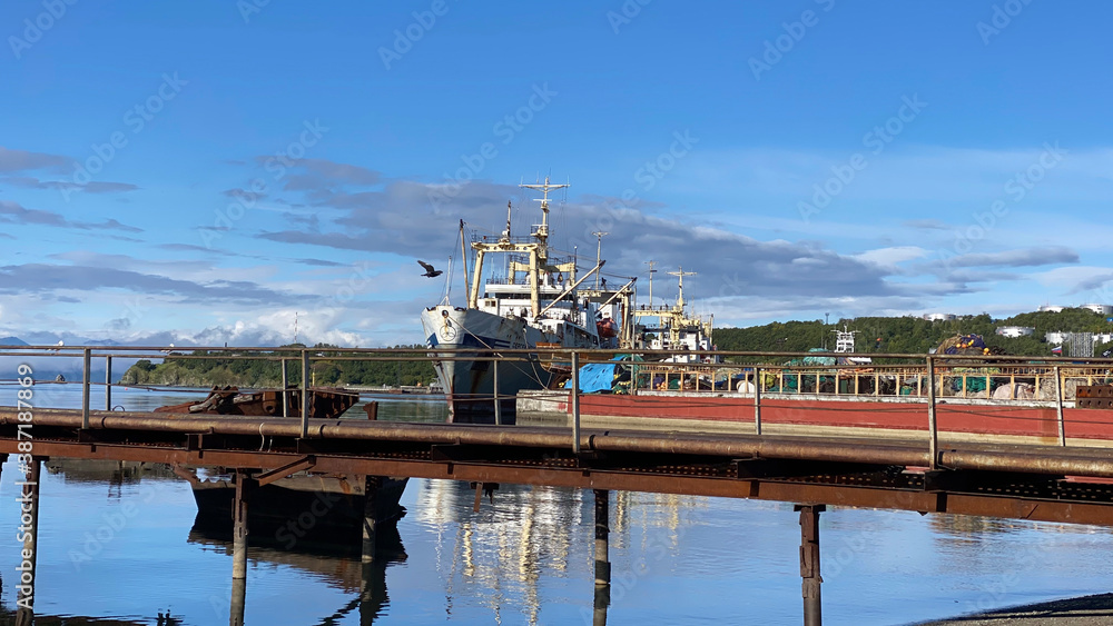Old ship at the pier in the port. The seaport of Petropavlovsk-Kamchatsky. Old ship at the pier in the port. The seaport of Petropavlovsk-Kamchatsky.