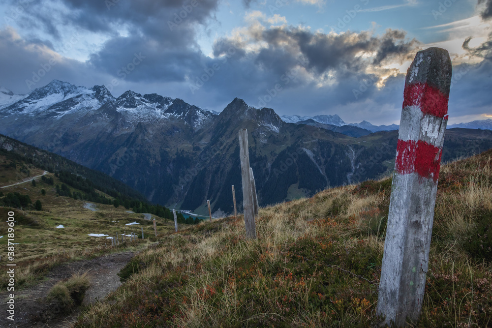 sunset landscape panorama of mountain trail with touristic sign in ski resort Zillertal arena in the Alps Austria sunset landscape panorama of mountain trail with touristic sign in ski resort Zillertal arena in the Alps Austria