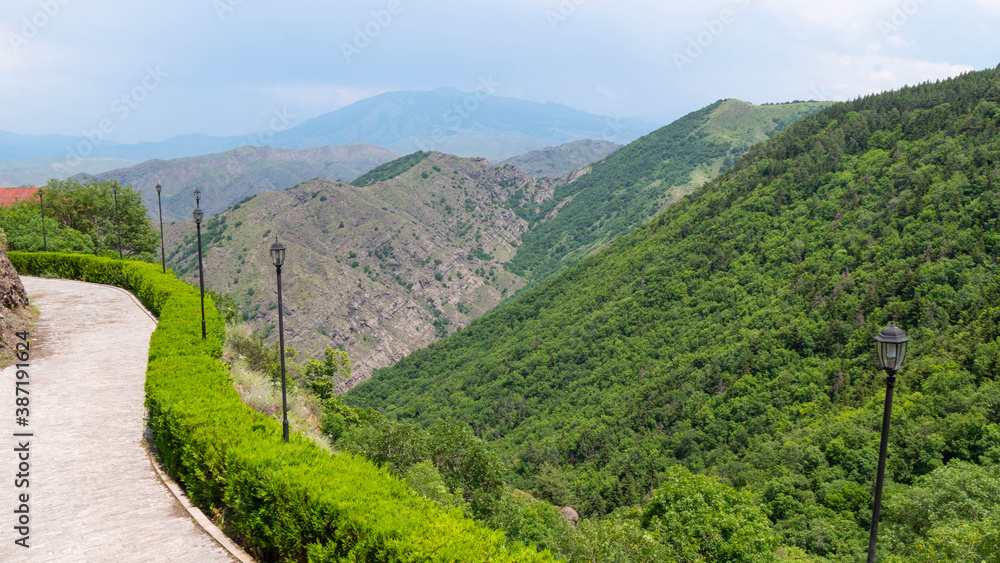 Winding road above the beautiful landscape of mountain forest