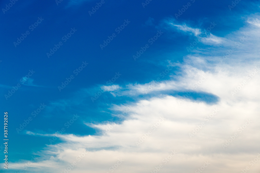 Beautiful blue sky with Cirrus Cumulus clouds. Panorama of the clear blue sky for your design. Sky background in Sunny weather.