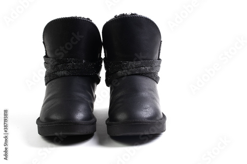 Black stylish winter boots with fur. Ugg boots. Isolated on a white background © Кирилл Горшков