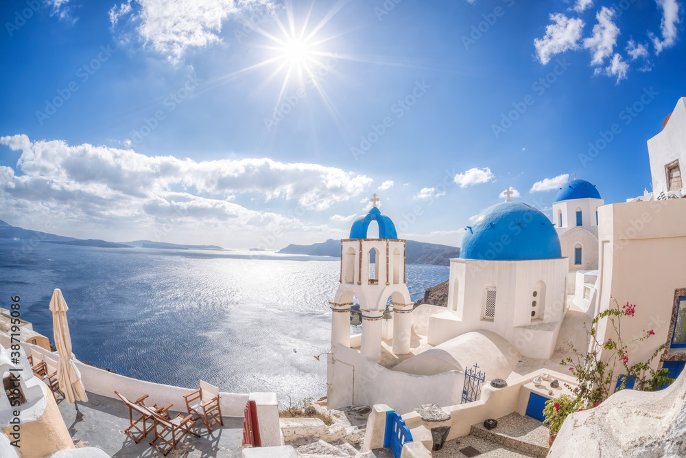 Obraz premium Oia village with churches against azure sea on Santorini island in Greece