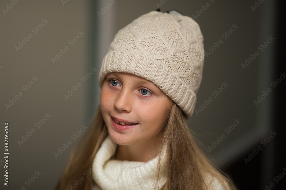 Close-up portrait of adorable smiling child girl wearing knitted hat Close-up portrait of adorable smiling child girl wearing knitted hat