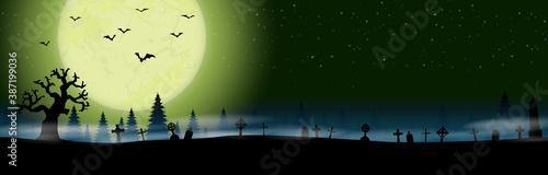 halloween cemetery in front of woodlands with full moon