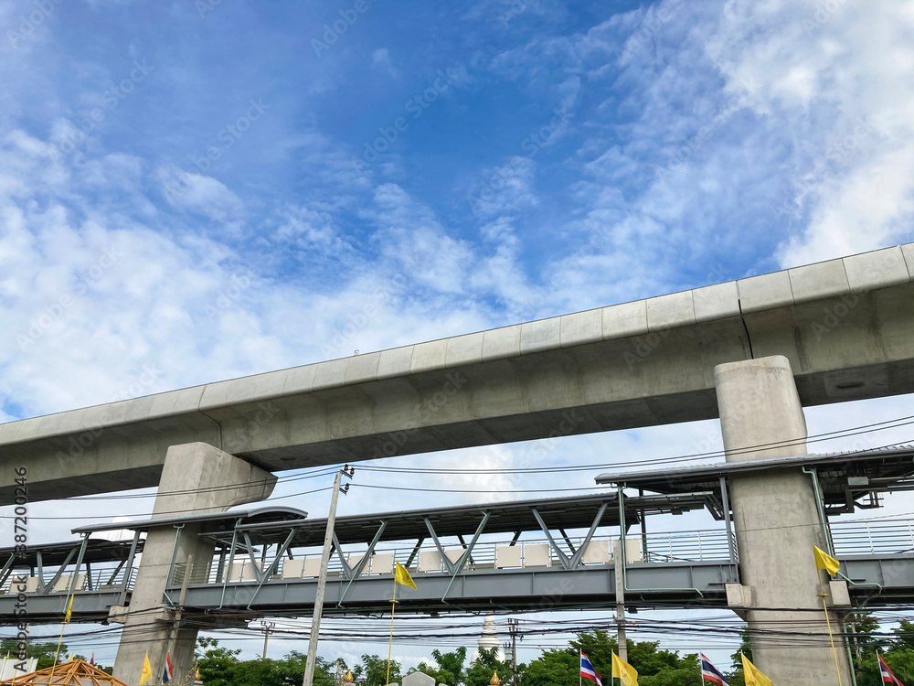 The elevated train tracks with a backdrop of clear skies. And have the national flag of Thailand The elevated train tracks with a backdrop of clear skies. And have the national flag of Thailand