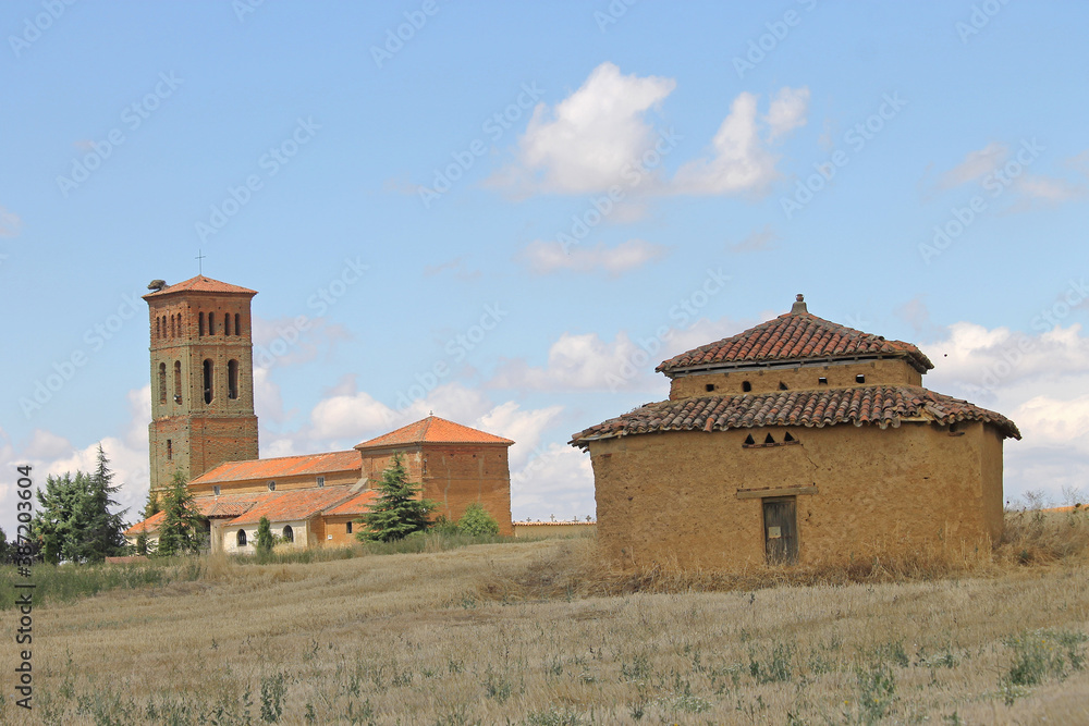 A dovecote and the church of the town of Villacintor, in the province of León