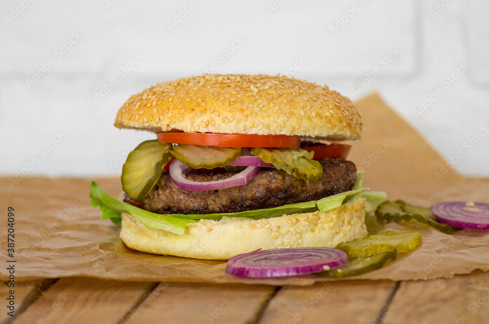 hamburger on a wooden table hamburger on a wooden table