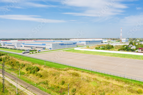 Aerial view of warehouse buildings of business park in countryside