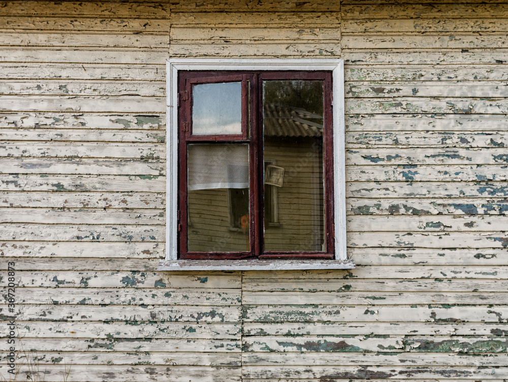 walls and window of an old abandoned village wooden house in Ukraine walls and window of an old abandoned village wooden house in Ukraine