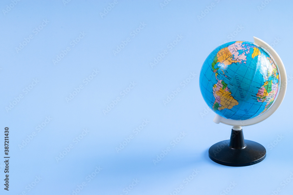 Globe on a blue background. Globe for geography lessons. Geography concept.