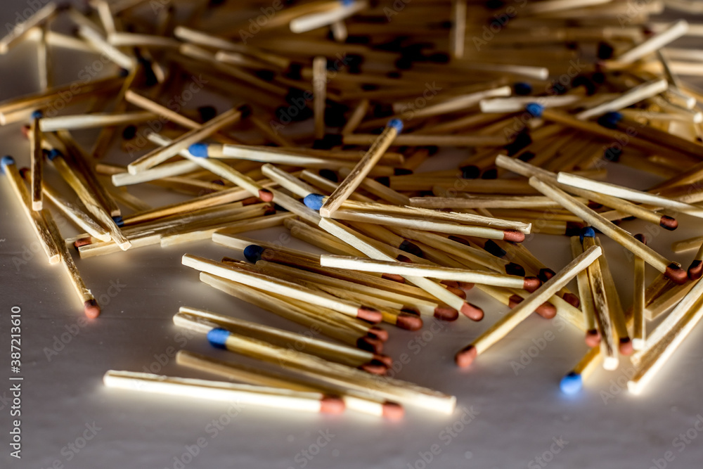 pile of blue matched sticks on dark background pile of blue matched sticks on dark background