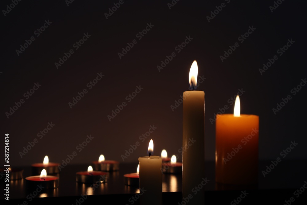Candle black background of mourning funeral moment of silence Candle black background of mourning funeral moment of silence