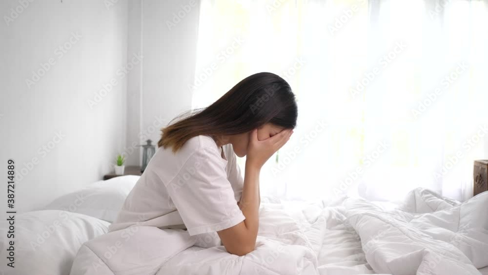 Lonely girl crying on the bed with sadness Lonely girl crying on the bed with sadness