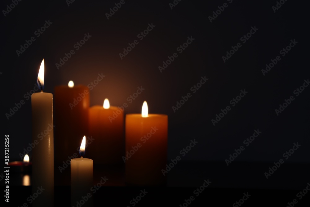 Candle black background of mourning funeral moment of silence Candle black background of mourning funeral moment of silence