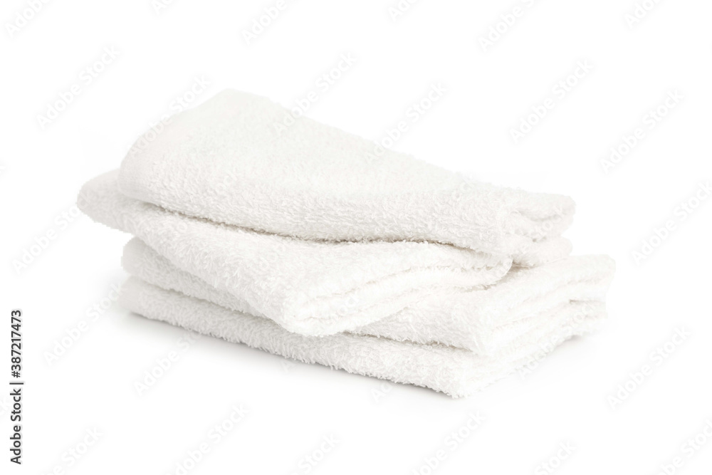 several white beach cotton towels folded on white background several white beach cotton towels folded on white background