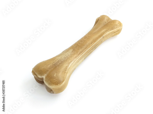 Pressed bone shaped Teether for dog puppies isolated on white background. Close up. Pet Dog Toy Teether, Molar Teeth Cleaner, Puppy Dog Toothbrush. Product for the dental care of pets.