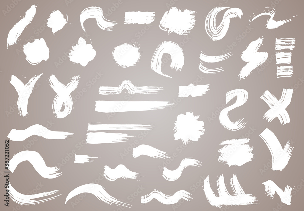 Naklejka premium Paint brush. White ink grunge brush strokes. Vector paintbrush set. Grunge design elements. Painted ink stripes