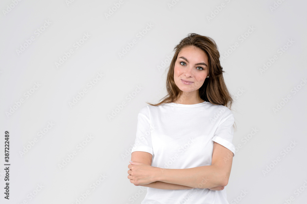 Portrait of smiling woman, isolated on white background, with folded arms Portrait of smiling woman, isolated on white background, with folded arms