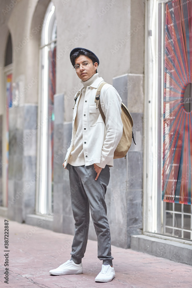 young man wearing white clothes in the city young man wearing white clothes in the city