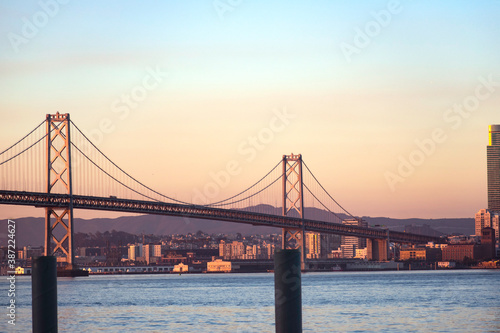 View of the sea and the Bay Bridge at sunrise © TakakoPhillips