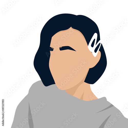 a girl with dark hair and eyebrows with white hairpins on her head and in a gray sweater