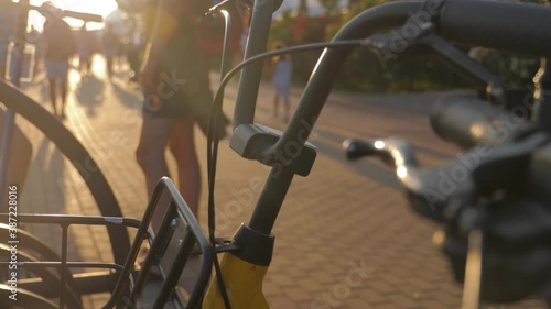 Bikes in a row at a rental station or a shop.