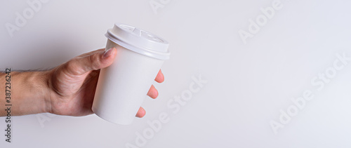 white paper Cup in hand, mockup, copy space, banner