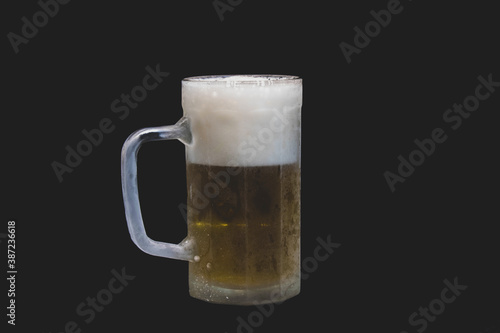 a full beer mug with black background