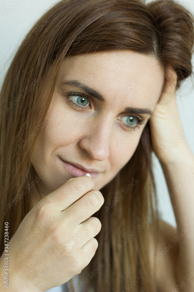 Close up view of ill sick woman taking pill to relieve pain concept, female hands holding meds puts medication, daily supplements or antibiotic antidepressant painkiller for weight loss into mouth. Close up view of ill sick woman taking pill to relieve pain concept, female hands holding meds puts medication, daily supplements or antibiotic antidepressant painkiller for weight loss into mouth.