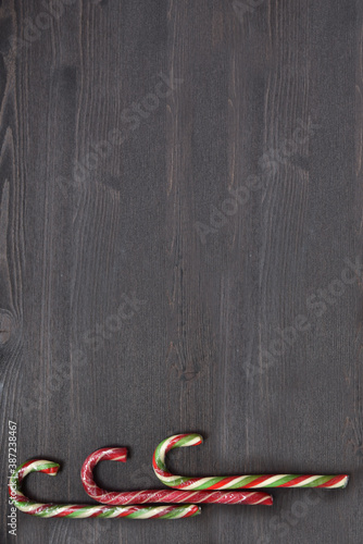 Christmas lollipops on a wooden background. Sweet treat for children and adults on holidayChristmas lollipops on a wooden background. Sweet treat for children and adults on holiday photo