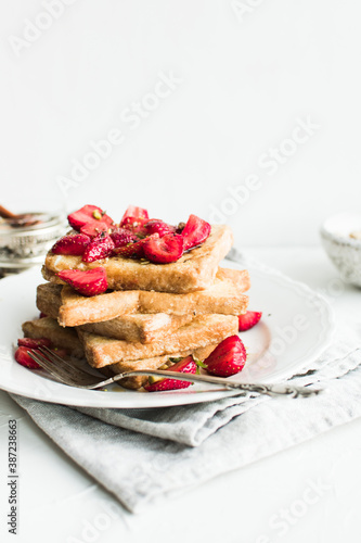 French toast with strawberries and maple syrup