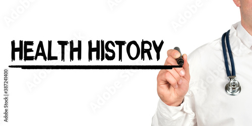 Doctor writes the word - HEALTH HISTORY. Image of a hand holding a marker isolated on a white background.