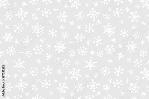 Vector Christmas background with hand drawn snowflakes.