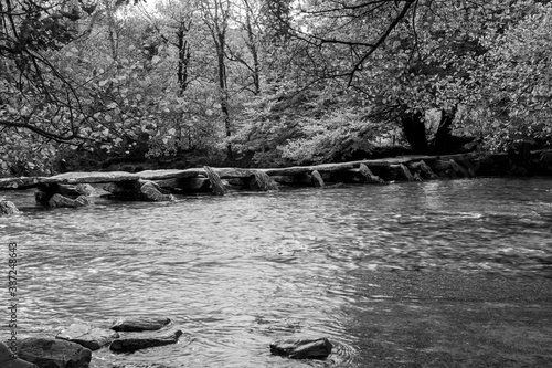 Black and white photo of the clapper bridge at Tarr Steps in Exmoor National Park photo