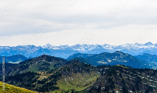 View from Hochgrat mountain nearby Oberstaufen (Bavaria, Bayern, Germany) on alps mountains in Tyrol, Vorarlberg. Hochvogel, big, Grosser Klottenkopf, Austria. Good hiking way © Mikalai