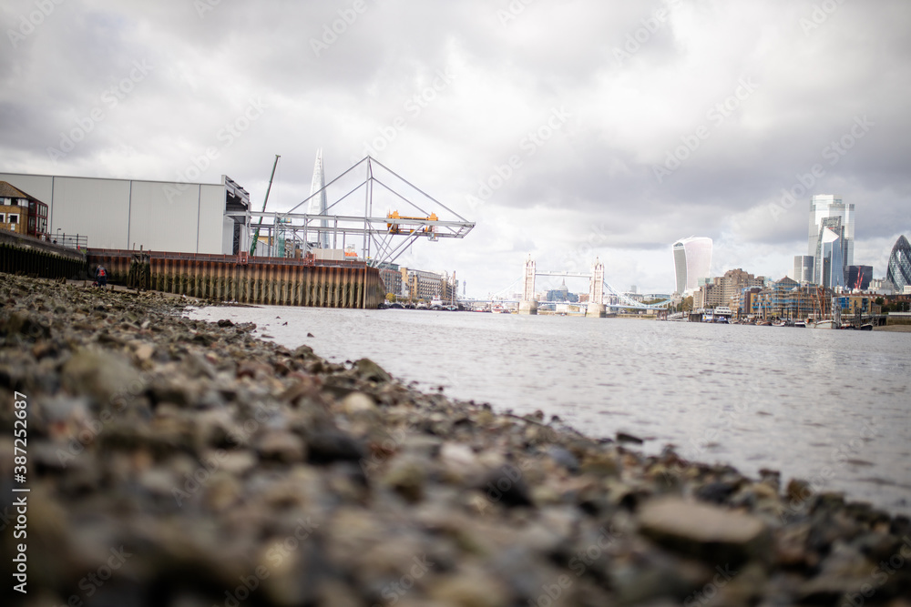 Landscape View of a Cityscape from the Rocky Ground Alongside the River Thames Landscape View of a Cityscape from the Rocky Ground Alongside the River Thames
