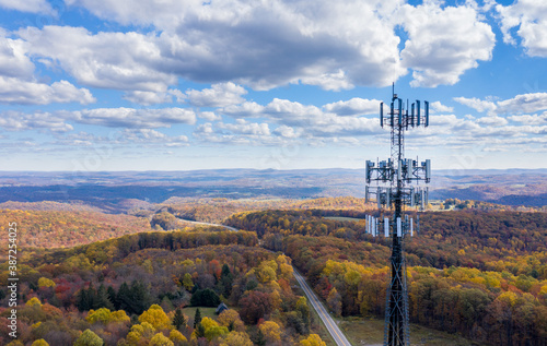 Aerial view of mobiel phone cell tower over forested rural area of West Virginia to illustrate lack of broadband internet service photo