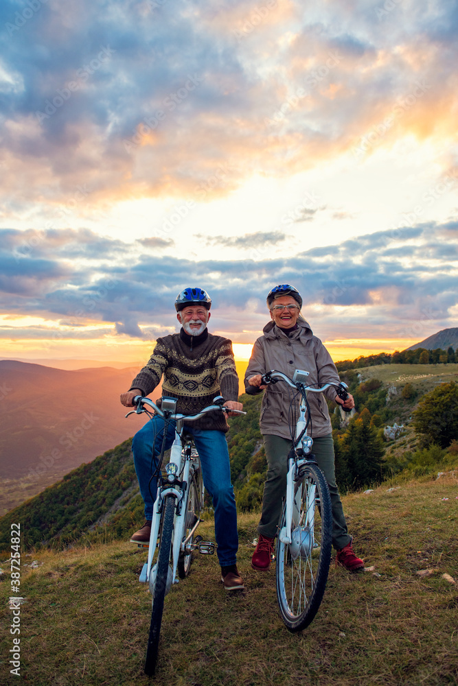 Senior Couple On Cycle Ride In Countryside Senior Couple On Cycle Ride In Countryside