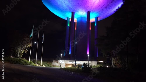 Espoo, Finland - October 20, 2020: Colorful light show on old water tower at Haukilahti, that is transformed to be used as restaurant