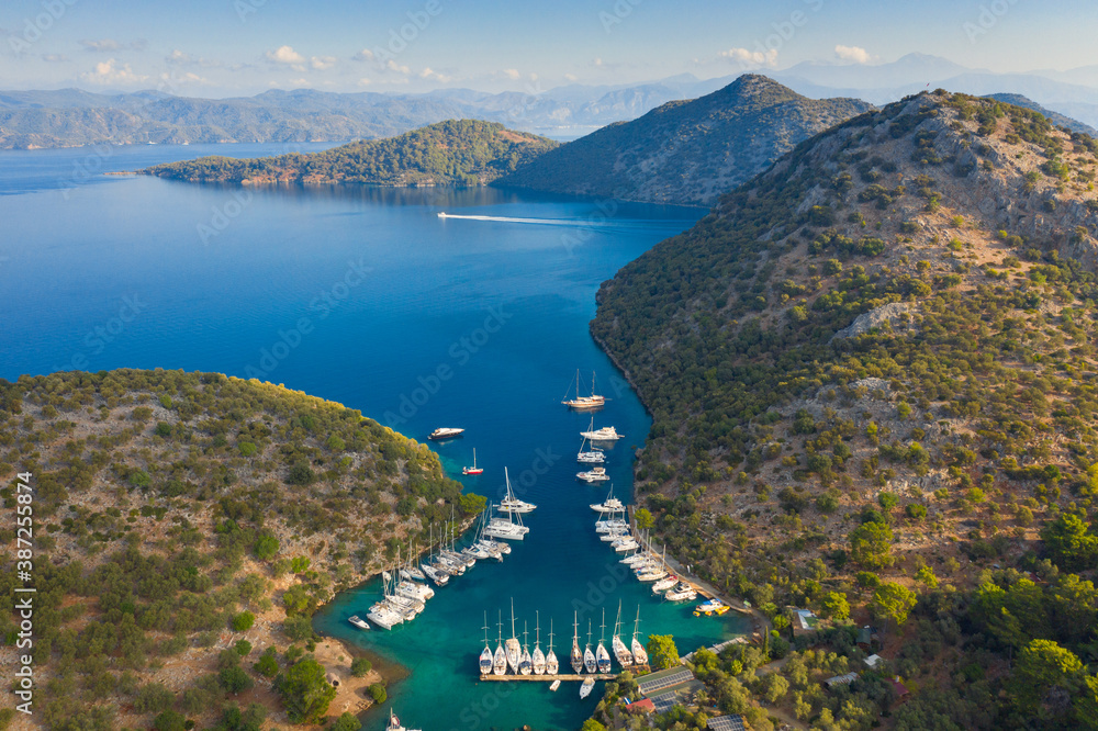 view to marine in bay between mountains in the morning with copy space