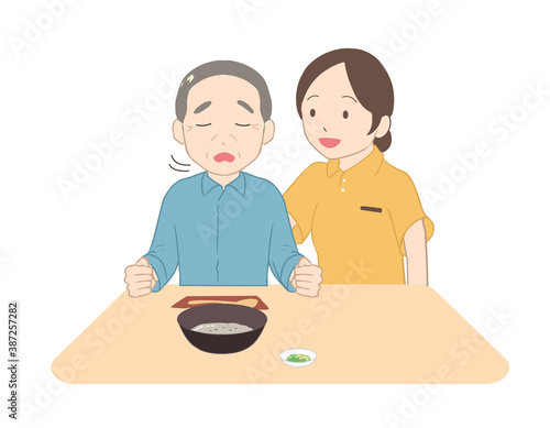 お粥を嫌がる高齢男性　女性介護士(線無し)