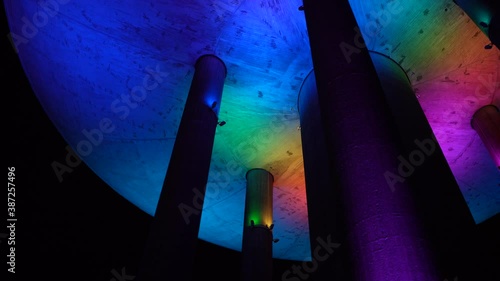 Espoo, Finland - October 20, 2020: Colorful light show on old water tower at Haukilahti, that is transformed to be used as restaurant