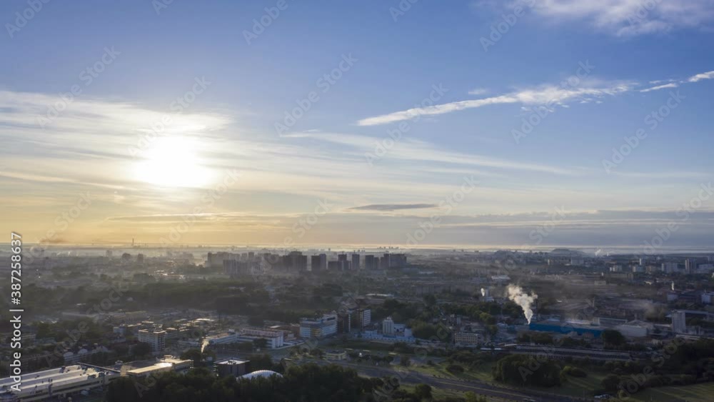 Aerial bird-eye view cityscape on sunrise, hyperlapse. View of the morning townscape of Minsk in the fog. Aerial bird-eye view cityscape on sunrise, hyperlapse. View of the morning townscape of Minsk in the fog.