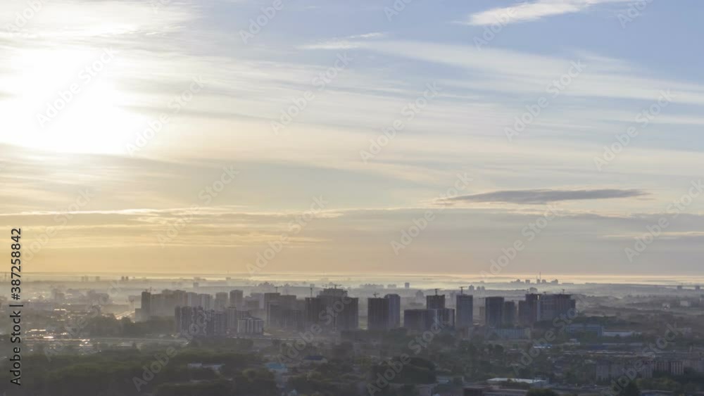 Aerial bird-eye view cityscape on sunrise, hyperlapse. View of the morning townscape of Minsk in the fog. Aerial bird-eye view cityscape on sunrise, hyperlapse. View of the morning townscape of Minsk in the fog.