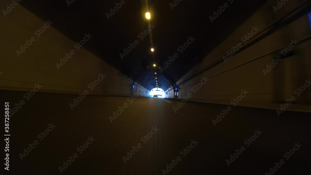 Time lapse night video of tunnel taken by stabilised camera attached to motorcycle as seen from lowest possible asphalt perspective Time lapse night video of tunnel taken by stabilised camera attached to motorcycle as seen from lowest possible asphalt perspective