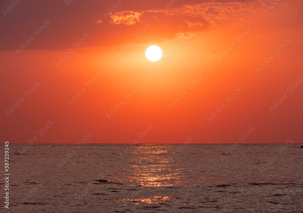 big sun over sea sunrise