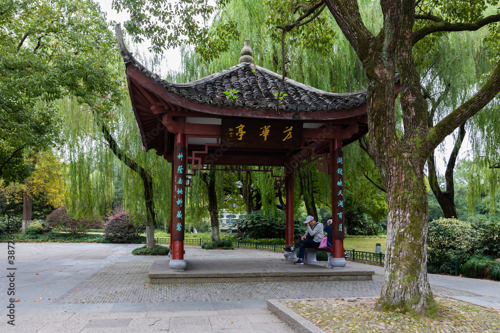 Fanghua Pavilion of traditional Chinese style by West Lake or Xihu, Hangzhou, Zhejiang, China. Place for a break or relaxation. Fanghua Pavilion of traditional Chinese style by West Lake or Xihu, Hangzhou, Zhejiang, China. Place for a break or relaxation.